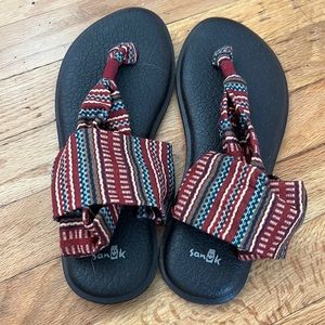 Never worn Sanuk sandals